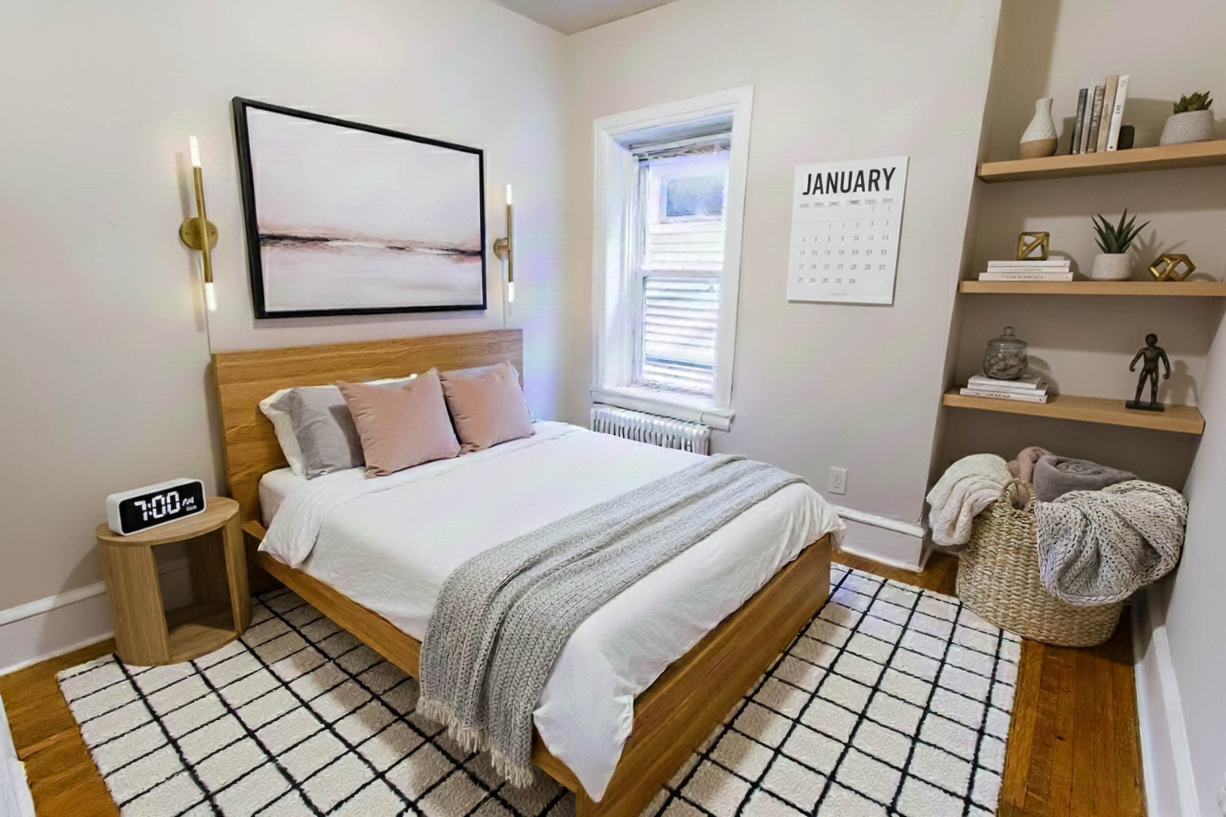 A bedroom with built-in shelves